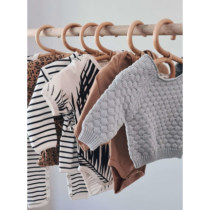 https://www.petitfilippe.com/cdn/shop/products/rattan-baby-clothes-hangers-set-of-3-401221.jpg?v=1666705934&width=416